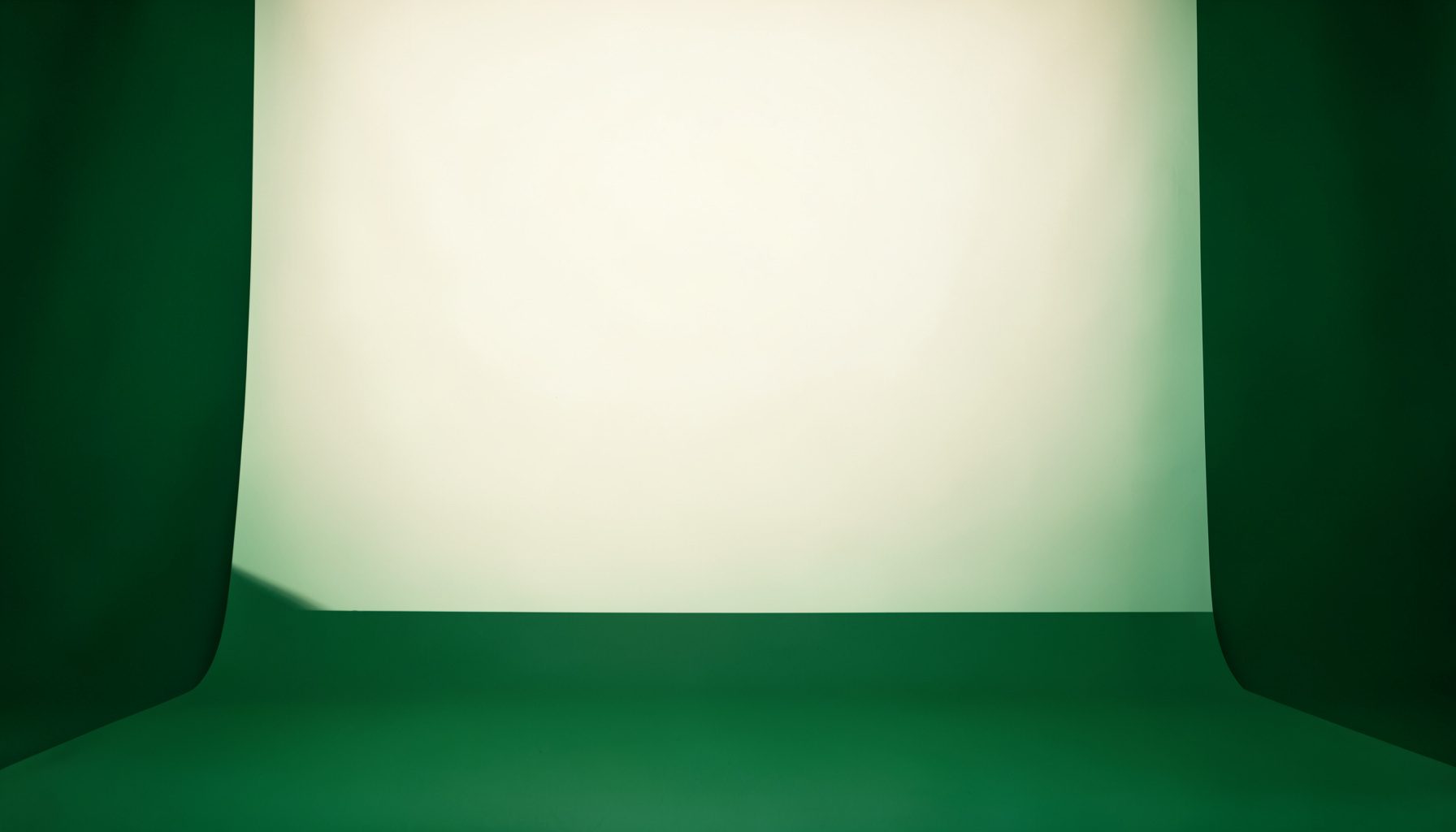 Soft cream backdrop with deep forest green accents, calm and advisory in tone